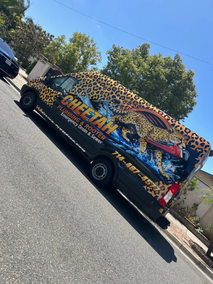 Cheetah Plumbing & Rooter service van wrapped in cheetah print