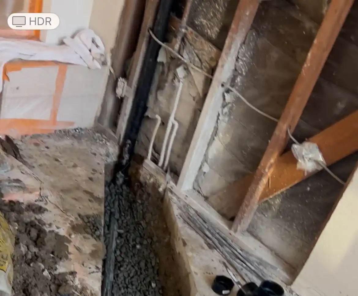 Open-wall repipe and slab leak repair in progress