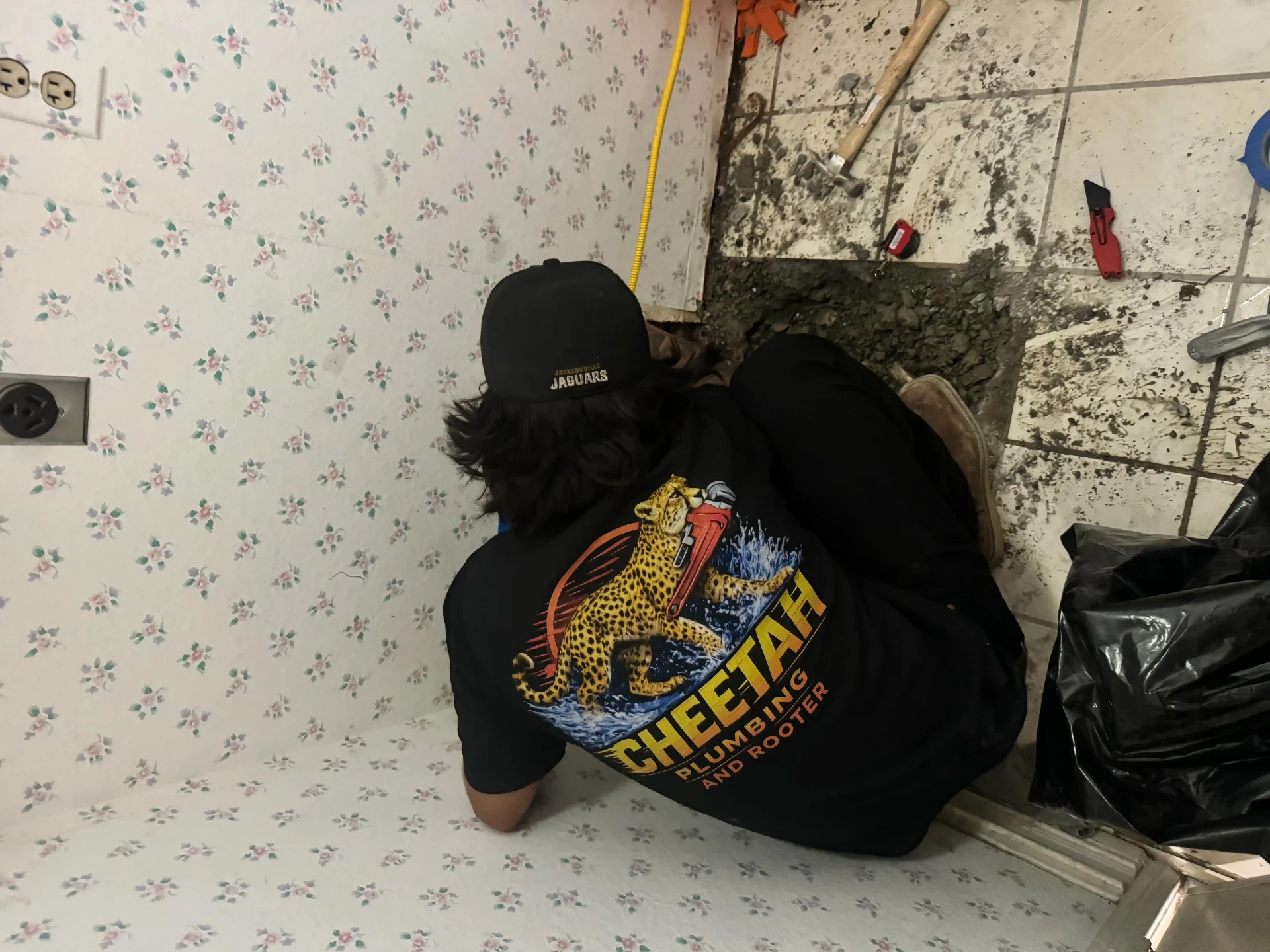 Cheetah technician repairing a floor drain line